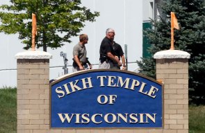 Officials gather near the Sikh Temple in Oak Creek in Wisconsin